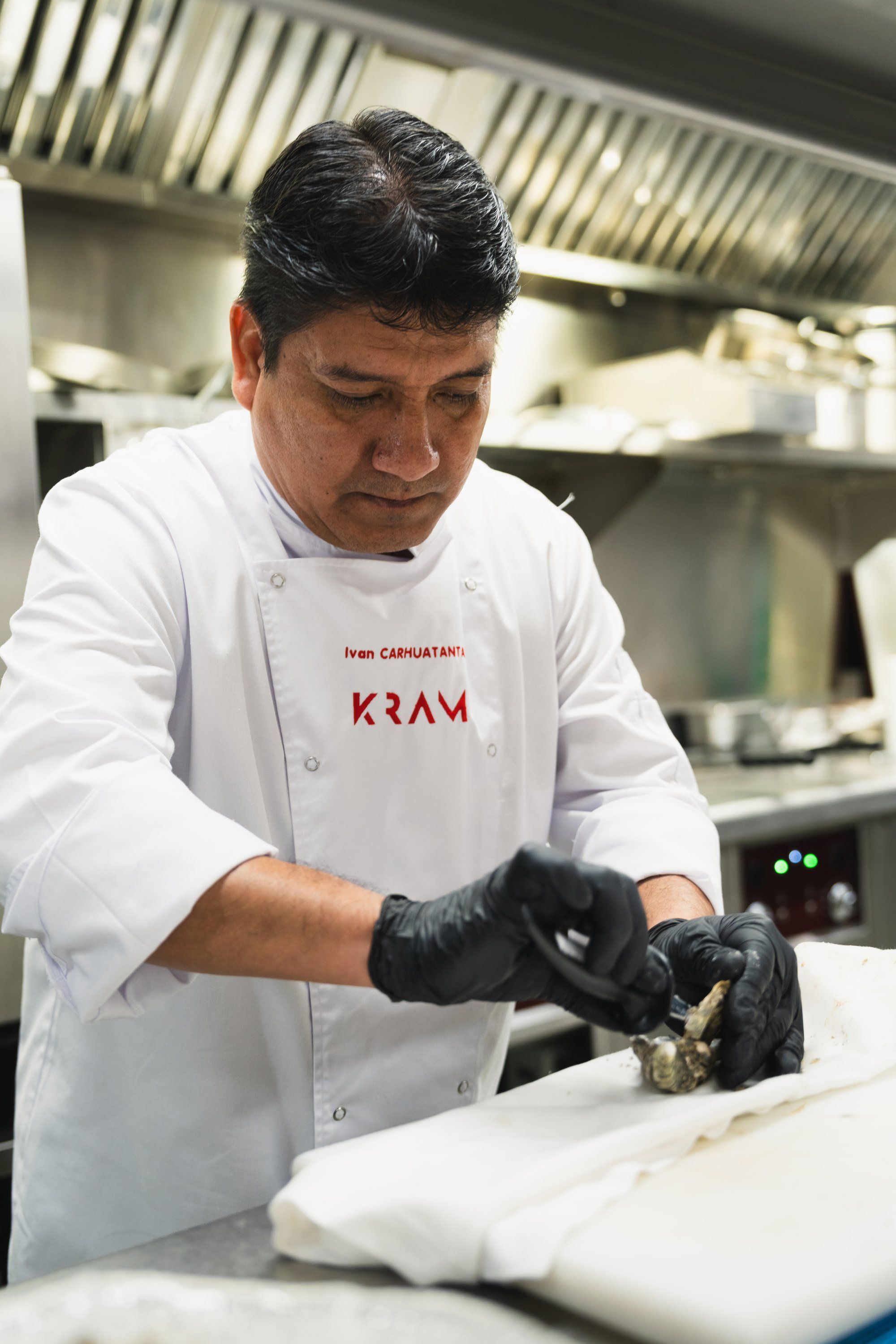 The chef shucking oysters to order